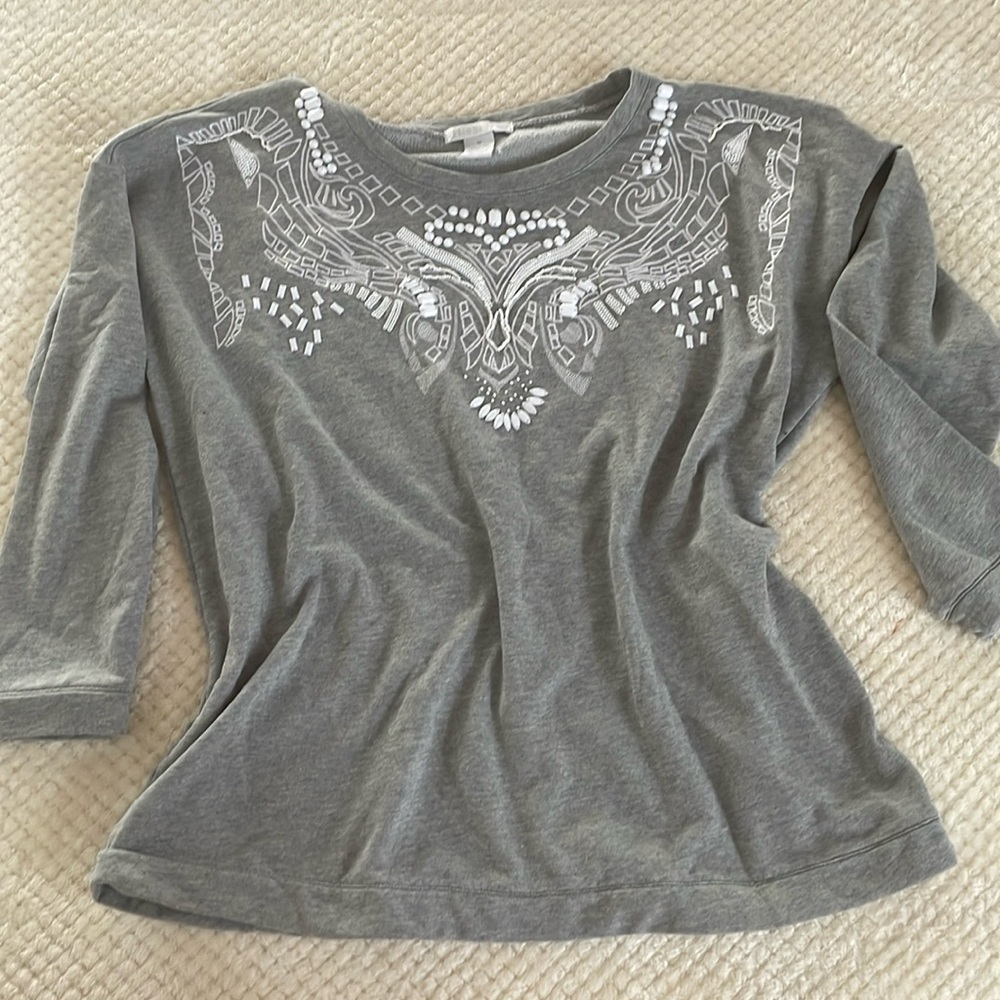 Embroidered sweater.